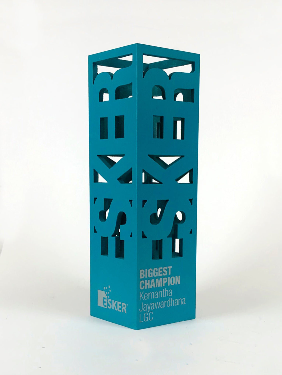 Bespoke blue decorative tower metal award with cut-out patterns and text. On a white background