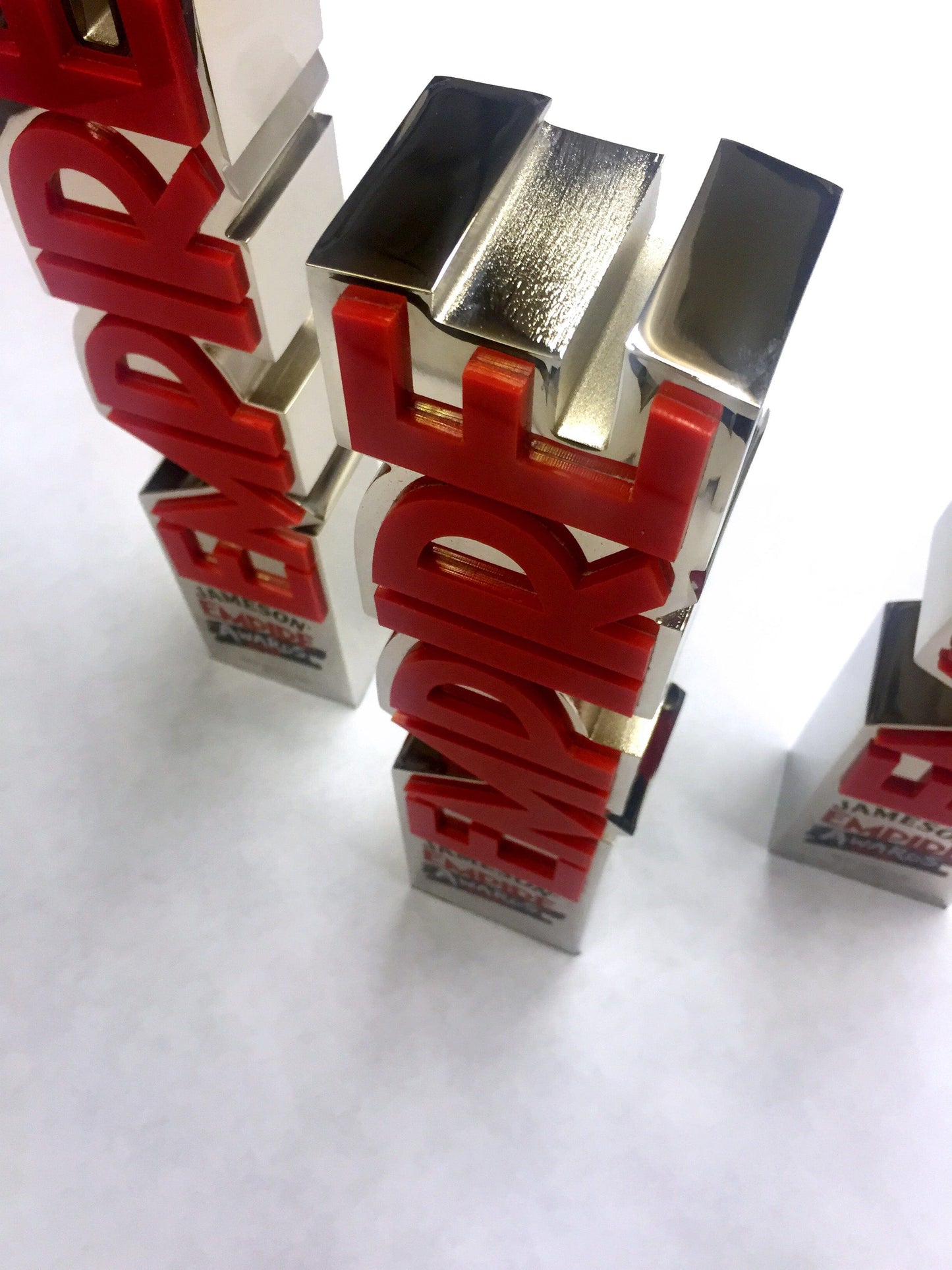 Red and silver Empire Film Awards on a white background