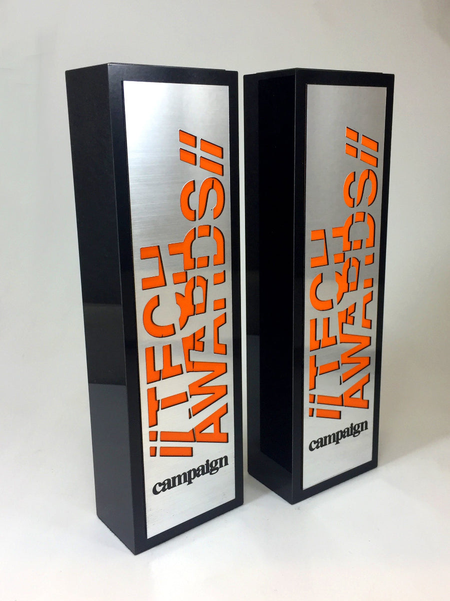Two black and silver metal awards with 'TECH AWARDS' and 'campaign' branding on a white background