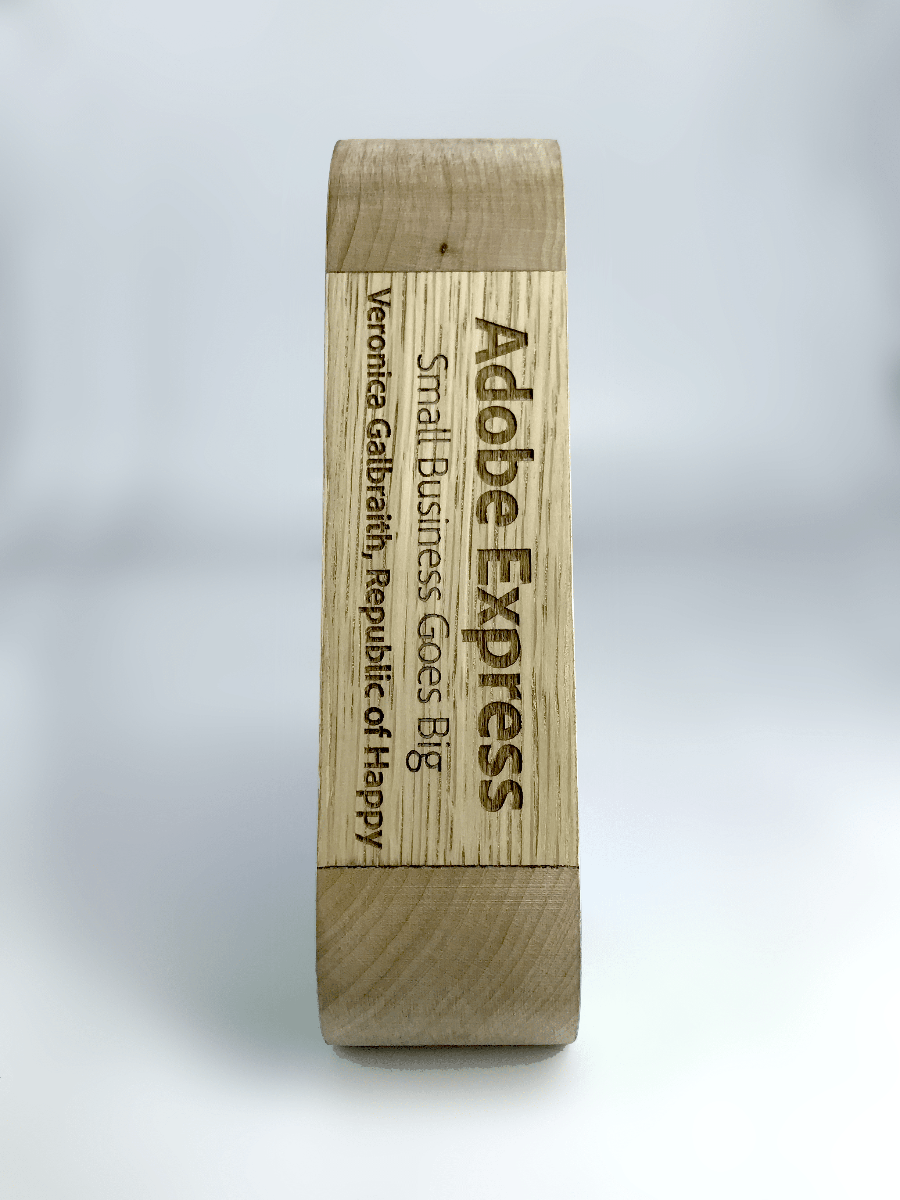 Wooden Spectrum Award engraving with laser on a white background