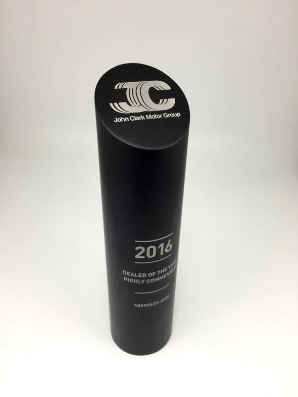 Black cylindrical award with 'John Clark Motor Group' logo and text on a white background