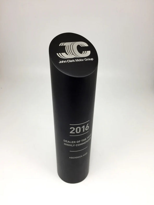 Black cylindrical award with 'John Clark Motor Group' logo and text on a white background