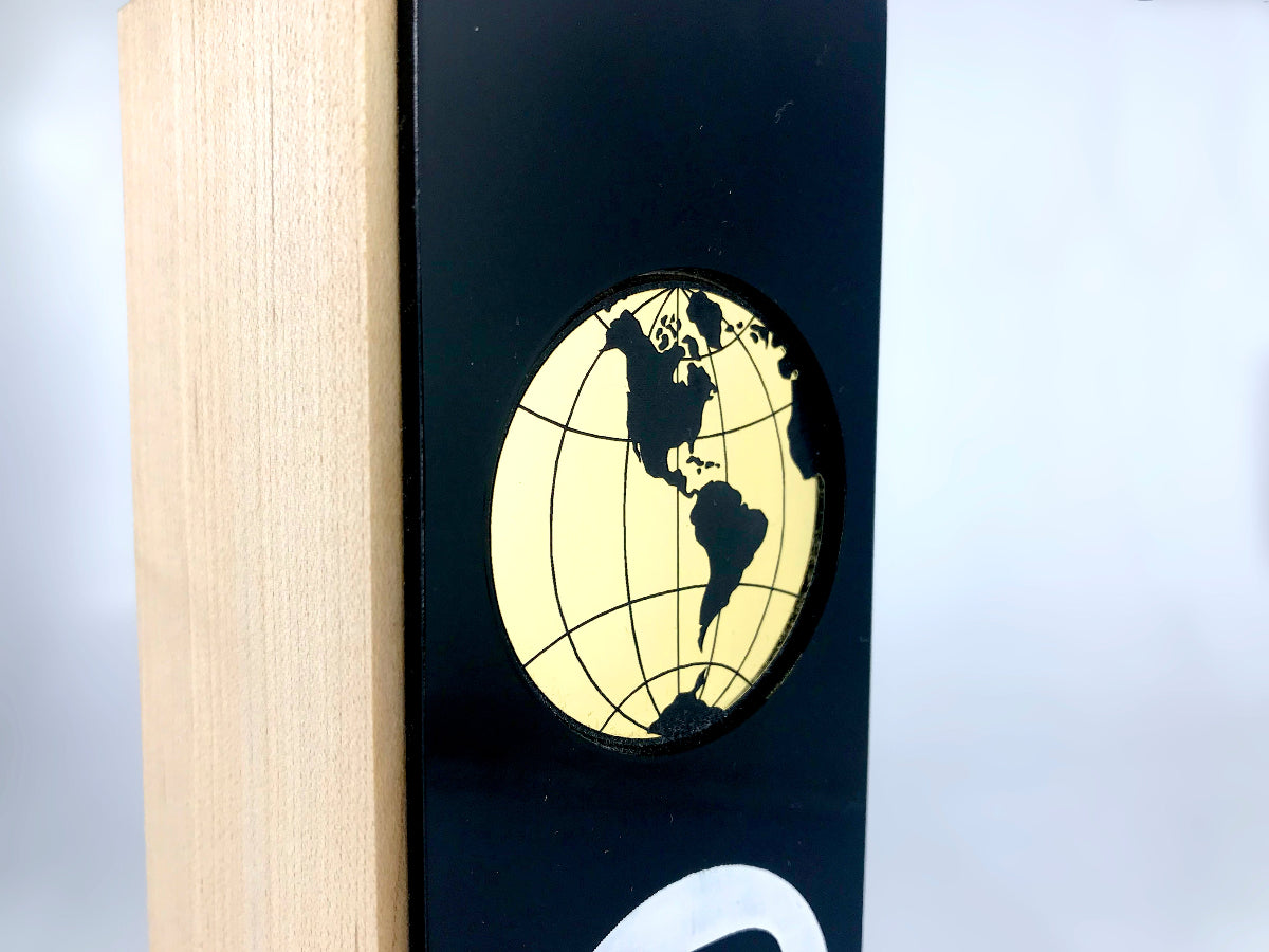 Wood, Black Perspex and Golden Globe Award up close golden globe engraving