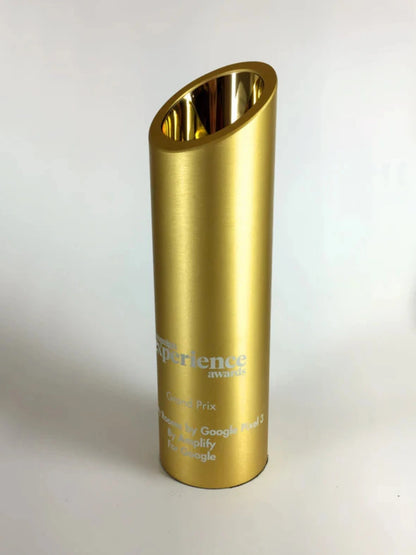 Gold cylindrical award with engraved text 