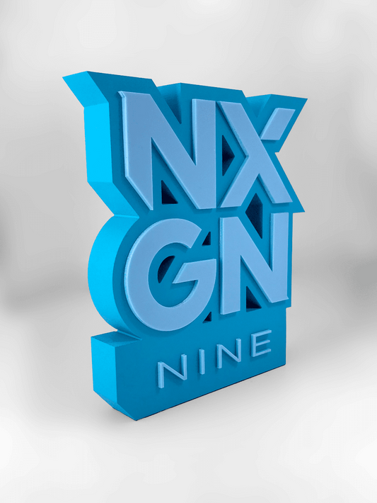 Blue 3D acrylic sculpture award with 'NXGN NINE' text on a white background
