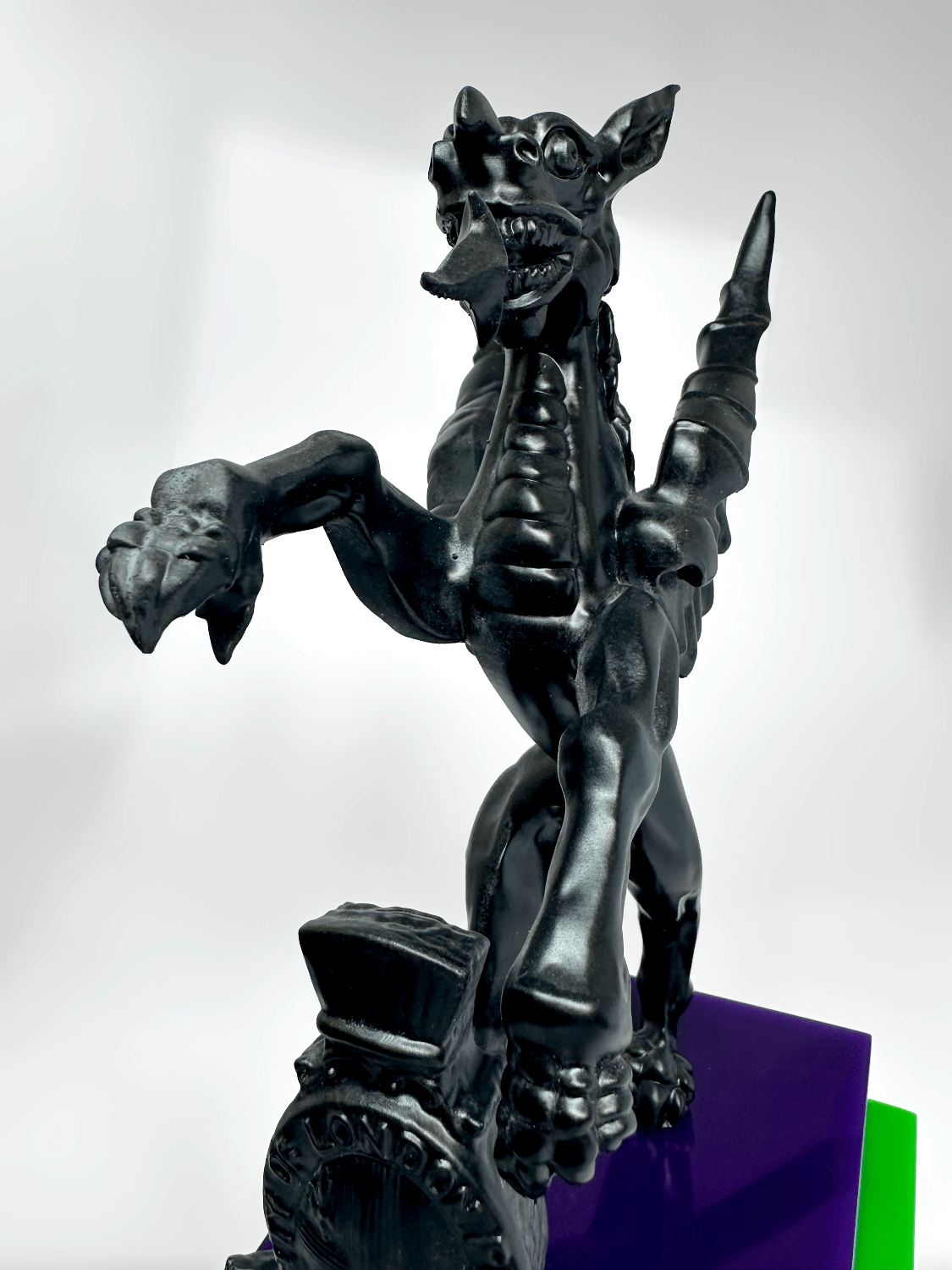 3D printed engineering resin griffin, hand-sculpted clay master detail showing scales and talons in matte black finish