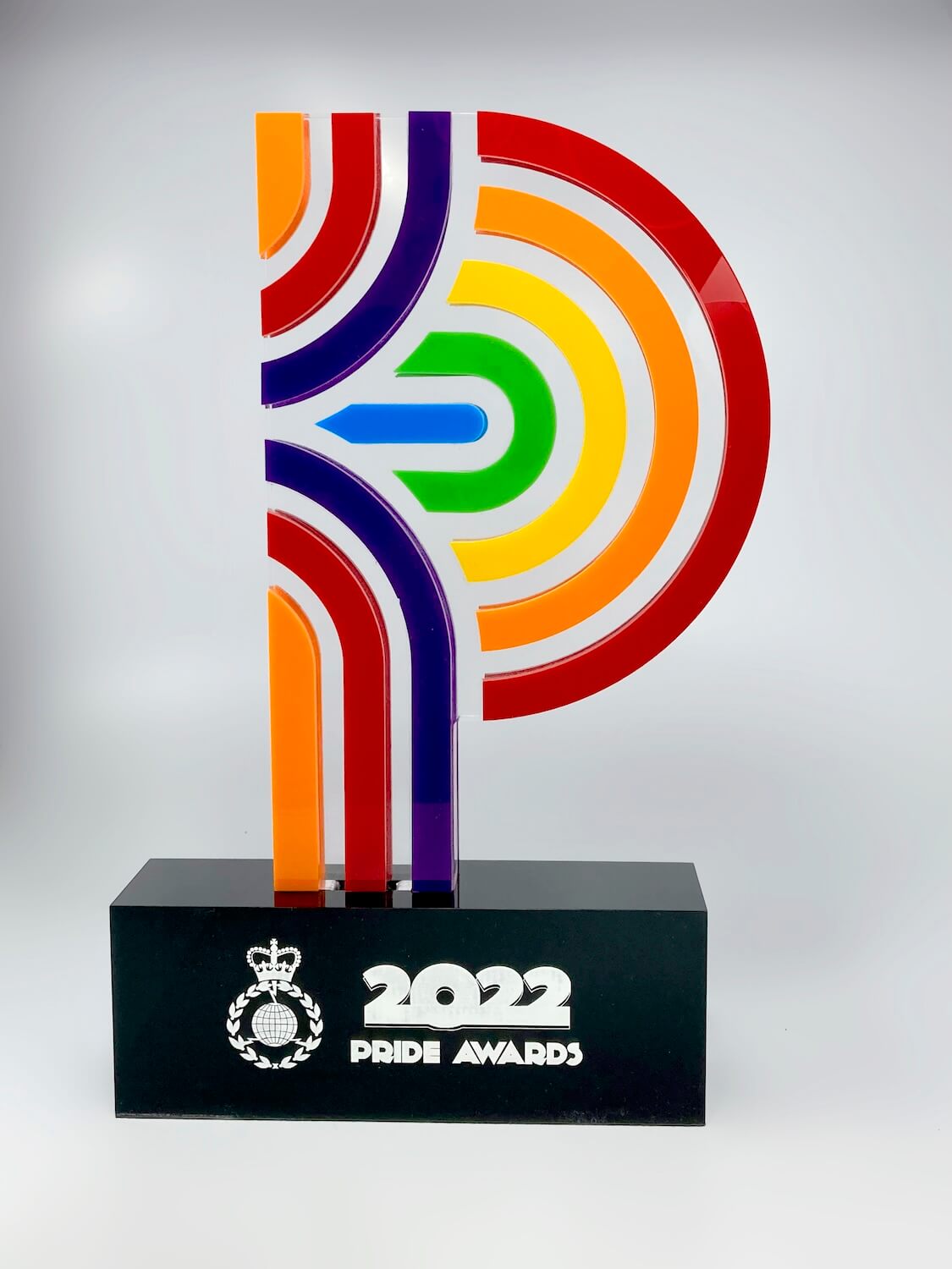 Colourful acrylic pride award front view, rainbow P-shape on gloss black engraved 2022 Pride Awards base