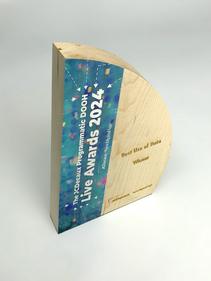 Wooden award with blue and multicolor design on a white background