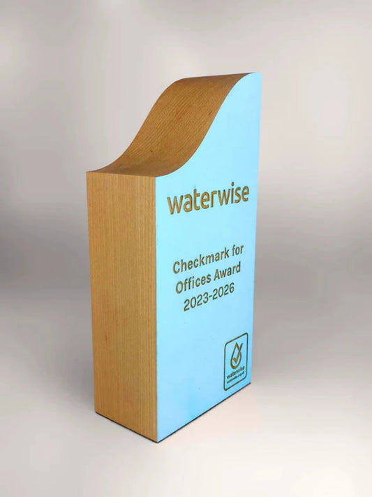 Wooden and blue award with 'Waterwise' branding on a gray background