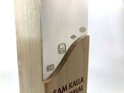Beautiful engraved sterling silver award inlay on a white background