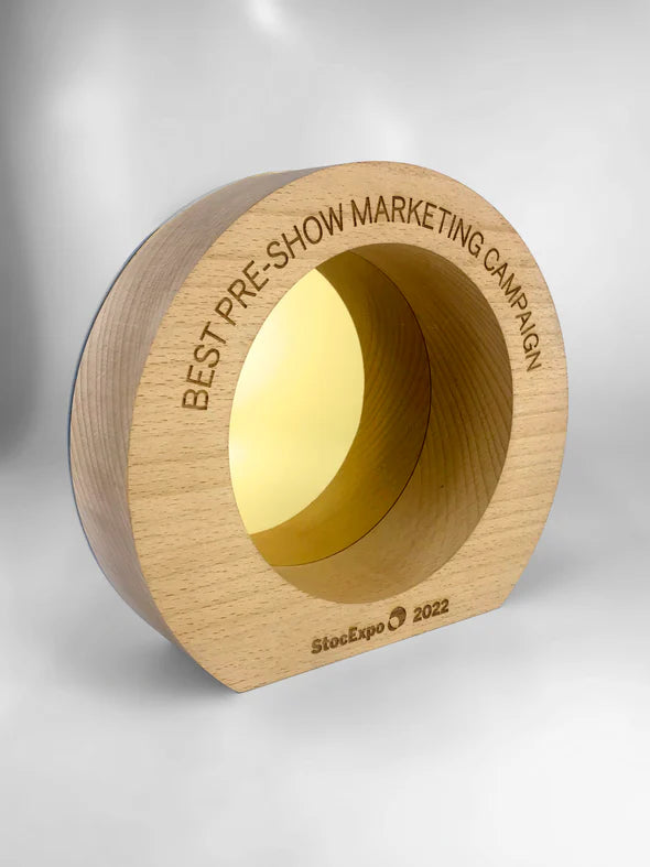 Wooden award with 'Best Pre-Show Marketing Campaign' text on a gray background