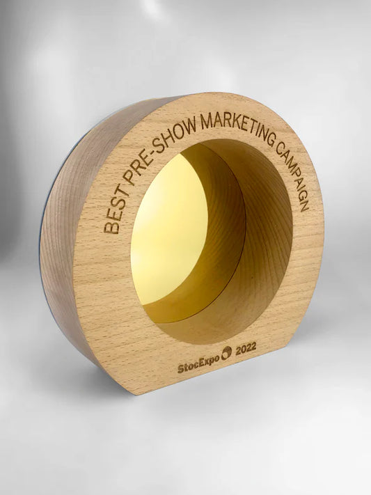 Wooden award with 'Best Pre-Show Marketing Campaign' text on a gray background