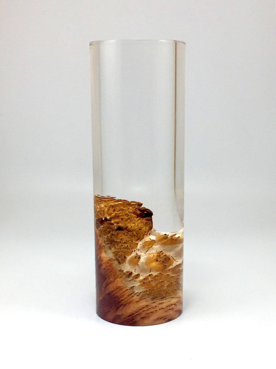 Cylindrical resin container with wooden base on a white background