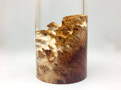 Cylindrical award with natural wood pattern on a white background