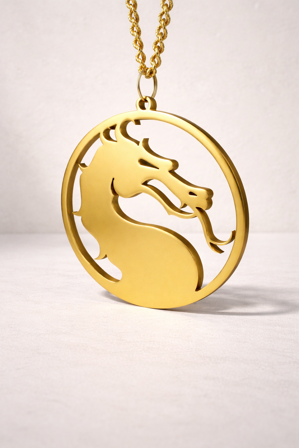 Gold plated dragon medal on a light gray background