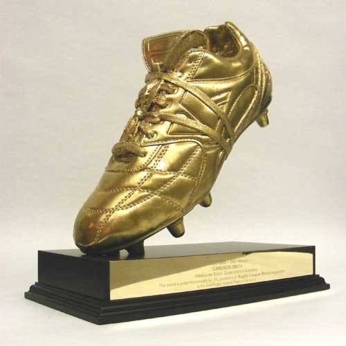 Gold rugby boot trophy on a black base with engraved text