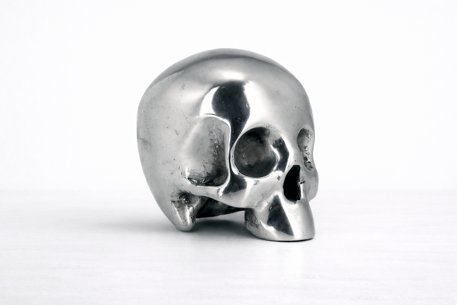 Silver skull trophy on a white background